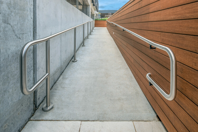 Accessible garden pathway with tactile paving and handrails